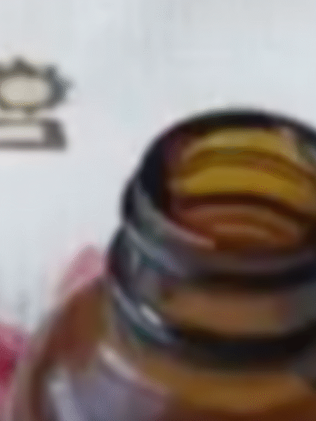 Botella ámbar con el antimosquitos